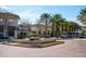 Beautiful town center with storefronts, lush palm trees and landscaped fountain featuring shops, dining and community events at 4725 Anson Ln, Orlando, FL 32814