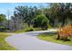 Picturesque walking path with mature trees and native vegetation in a serene park setting at 4725 Anson Ln, Orlando, FL 32814