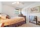 Cozy bedroom featuring neutral colors, a ceiling fan, and a comfortable bed at 5001 Tangerine Ave, Winter Park, FL 32792