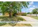 Charming single-story home with a well-maintained lawn and long driveway at 5001 Tangerine Ave, Winter Park, FL 32792