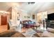 A living room with multiple sofas, a ceiling fan and hardwood flooring at 5001 Tangerine Ave, Winter Park, FL 32792