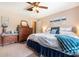 Bedroom with tile floors, ceiling fan, and coastal decor at 5001 Tangerine Ave, Winter Park, FL 32792