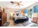 Bright main bedroom features en-suite bathroom, tile floors, and a sliding glass door to the outside at 5001 Tangerine Ave, Winter Park, FL 32792
