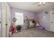 Cozy bedroom with gray carpet, a large window for natural light, and a playful decor at 502 Freeman St, Longwood, FL 32750