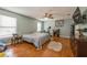 Main bedroom featuring hard wood flooring, ceiling fan, and neutral walls at 502 Freeman St, Longwood, FL 32750