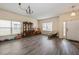 Spacious living room with laminate floors, large windows, and neutral paint at 502 Freeman St, Longwood, FL 32750