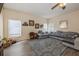 Inviting living room featuring an oversize sectional sofa and large windows at 502 Freeman St, Longwood, FL 32750