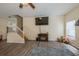 Living room with laminate floors, a staircase, and a TV at 502 Freeman St, Longwood, FL 32750