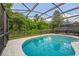 Inviting screened-in pool with clear blue water and a surrounding deck with mature landscaping at 502 Freeman St, Longwood, FL 32750