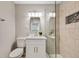 Modern bathroom with glass-enclosed shower, mosaic tiles, stylish vanity, and sleek fixtures at 507 Peach Tree Ln, Altamonte Springs, FL 32701