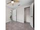 Empty bedroom features tile floors, a ceiling fan, and an open closet at 507 Peach Tree Ln, Altamonte Springs, FL 32701