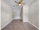 This neutral bedroom features a tile floor and a ceiling fan at 507 Peach Tree Ln, Altamonte Springs, FL 32701