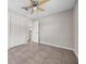 Empty bedroom with tile floors, ceiling fan and walk-in closet at 507 Peach Tree Ln, Altamonte Springs, FL 32701