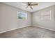 Empty bedroom with two windows and a ceiling fan at 507 Peach Tree Ln, Altamonte Springs, FL 32701