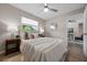 Bright bedroom with a ceiling fan, window, and a tastefully decorated bed with neutral tones at 507 Peach Tree Ln, Altamonte Springs, FL 32701