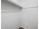 Empty closet interior, painted white with a single shelf and hanging rod at 507 Peach Tree Ln, Altamonte Springs, FL 32701