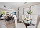 Open living and dining area with stylish furniture, art, and seamless flow, perfect for entertaining and relaxing at 507 Peach Tree Ln, Altamonte Springs, FL 32701