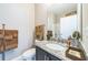Well-lit bathroom showcasing granite countertops, modern fixtures, and decorative towels at 525 Narrow View Ln, Groveland, FL 34736