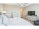 Cozy bedroom featuring a comfortable bed, matching nightstands, and plenty of natural light at 525 Narrow View Ln, Groveland, FL 34736