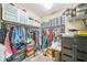 Spacious walk-in closet with ample shelving and storage options for clothes, shoes, and accessories at 525 Narrow View Ln, Groveland, FL 34736