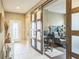 Entryway with decorative sliding barn doors leading to a home office space at 525 Narrow View Ln, Groveland, FL 34736