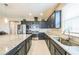 Modern kitchen with stainless steel appliances, granite countertops, and ample cabinet space at 525 Narrow View Ln, Groveland, FL 34736
