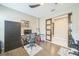 Bright office space with hardwood floors, an office chair, and decorative sliding doors at 525 Narrow View Ln, Groveland, FL 34736