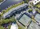 Aerial view of complex, tennis courts, meticulous landscaping, and serene surroundings at 6330 Masters Blvd # N4, Orlando, FL 32819