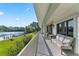 Expansive balcony with outdoor seating and stunning views of the lake at 6330 Masters Blvd # N4, Orlando, FL 32819