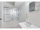 A bright bathroom featuring a shower/tub combination and a single sink vanity at 6330 Masters Blvd # N4, Orlando, FL 32819