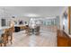 A bright dining area featuring tile floors, a chandelier, and a table with seating for six at 6330 Masters Blvd # N4, Orlando, FL 32819