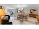 Bright, open dining area with tile flooring, natural lighting, and a large buffet against the back wall at 6330 Masters Blvd # N4, Orlando, FL 32819