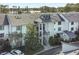 Stunning condominium exterior featuring multiple stories, staircase access, and a serene lakeside view at 6330 Masters Blvd # N4, Orlando, FL 32819