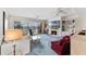 Bright living room with large windows, fireplace, built-in shelving, and ceiling fans at 6330 Masters Blvd # N4, Orlando, FL 32819