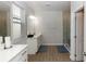 Light and airy bathroom featuring a walk-in shower, a toilet, and a vanity with a sink at 635 Cheval Ln, Debary, FL 32713