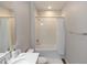 Full bathroom with shower-tub combination with white tiling and modern fixtures at 635 Cheval Ln, Debary, FL 32713
