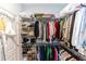 Walk-in closet with shelving and racks, offering ample storage space for clothing and accessories at 635 Cheval Ln, Debary, FL 32713