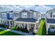 Beautiful two-story home featuring a covered front porch, neutral colors, and well-maintained landscaping at 635 Cheval Ln, Debary, FL 32713