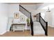Spacious foyer with modern staircase, neutral decor, and stylish accents that enhance the home's appeal at 635 Cheval Ln, Debary, FL 32713