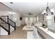 View from stairs showing the home's open floor plan with dining and living area at 635 Cheval Ln, Debary, FL 32713