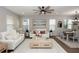 Sunlit living area with contemporary furniture, neutral decor, and an open layout to dining space at 635 Cheval Ln, Debary, FL 32713