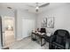 Home office with a desk, black leather chair and large massage chair near a closet and doorway at 635 Cheval Ln, Debary, FL 32713