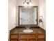 Bathroom features granite countertop and ample drawer space in wooden vanity at 7689 Heritage Crossing Way # 202, Reunion, FL 34747