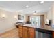 Kitchen with sink and cabinetry overlooking adjacent living area at 7689 Heritage Crossing Way # 202, Reunion, FL 34747