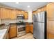 Modern kitchen featuring stainless steel appliances and stylish cabinetry at 7689 Heritage Crossing Way # 202, Reunion, FL 34747