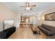 Open floor plan living room with bar seating and access to kitchen at 7689 Heritage Crossing Way # 202, Reunion, FL 34747