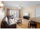Comfortable living room with wood floors and a view to the outdoor balcony at 7689 Heritage Crossing Way # 202, Reunion, FL 34747