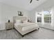 Inviting bedroom with a queen bed, side tables, and views of the screened-in patio at 833 Lockbreeze Dr, Davenport, FL 33897