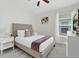 Comfortable bedroom with a queen bed, neutral decor, and ample natural light at 833 Lockbreeze Dr, Davenport, FL 33897