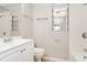 Bathroom featuring a bathtub, toilet, and sink with white cabinetry at 845 N Ludlum Dr, Deltona, FL 32725